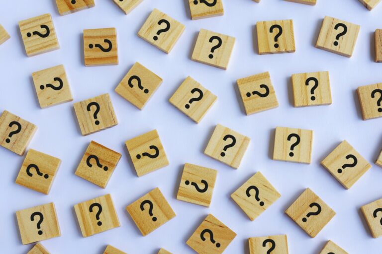 Wooden building blocks with question marks